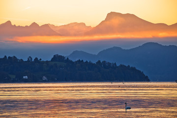 Lake Luzern and Rigi mountain peak morning golden glow view