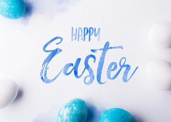 Happy Easter flat lay on a white background.