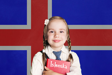 Little girl pupil with book against the Iceland flag background. Learn Icelandic language, Iceland concept