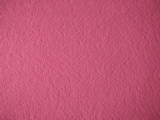 Fototapeta premium texture of homogeneous felt, solid pink fabric background