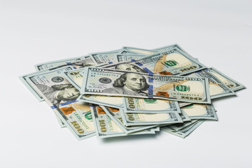 Many bundle of US 100 dollars bank notes isolated