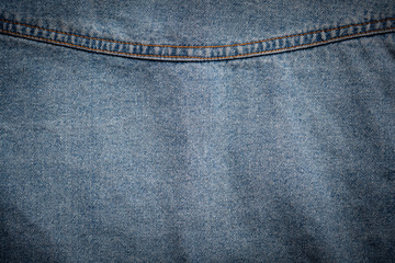Fototapeta premium Background of blue jeans cloth fabric texture backdrop.
