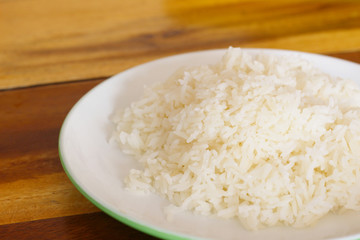 jasmine rice on wood Background