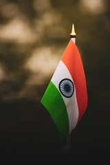 Tricolor national flag of India consists of Saffron white and green colours respectively with the Ashoka Chakra in the middle. 