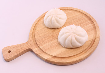 Steamed buns on the wooden floor.