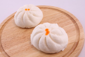 Steamed buns on the wooden floor.