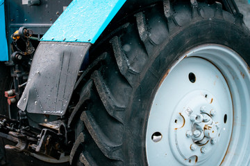 Black big wheel from the tractor. Snowblower. Equipment