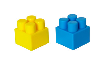 details of a children's plastic constructor on a white background. colored cubes. building