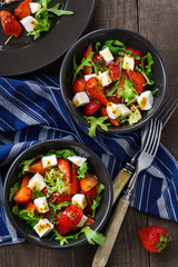 Vegetarian salad with strawberry, tofu and aragula overhead shot