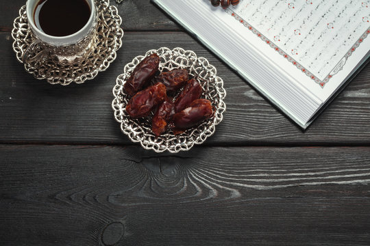 The Open holy Quran with tasbih/rosary beads close up