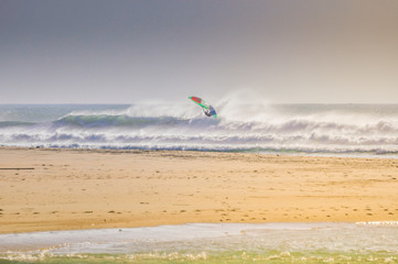 Windsurfer jumping a wave in Conil