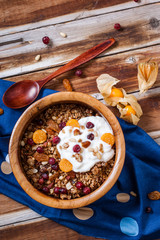 Homemade granola with nuts, cranberries and yogurt.