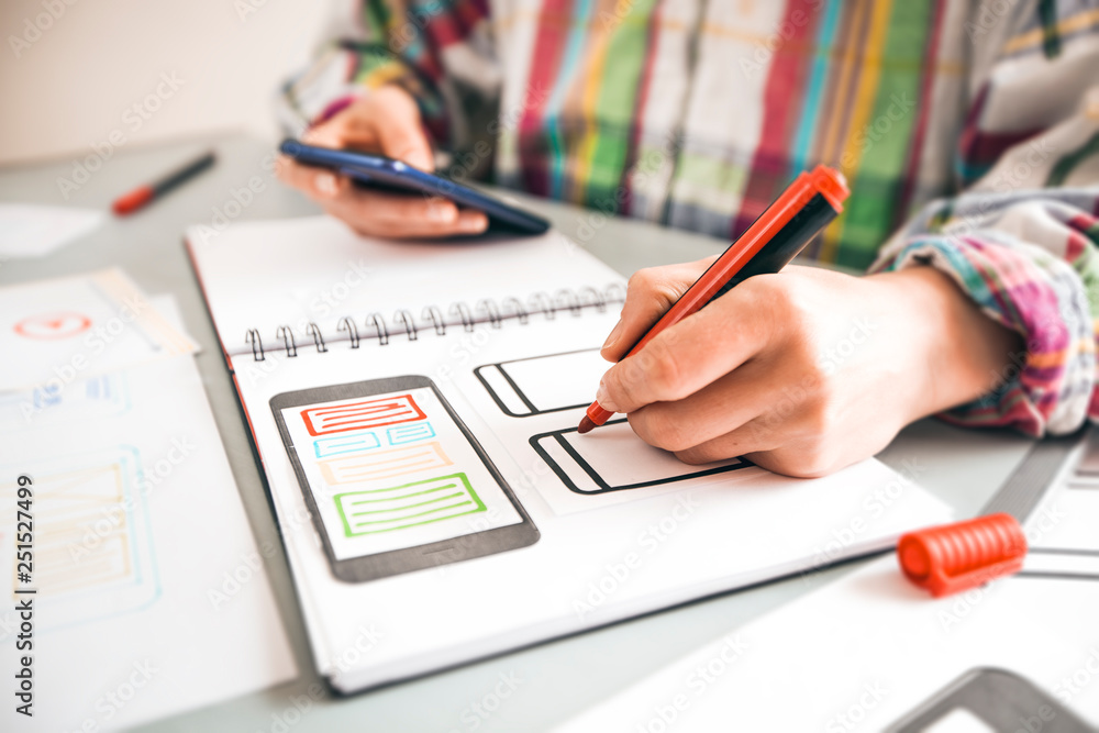 Poster designer develops applications for mobile phones. people creates a prototype user experience interfa