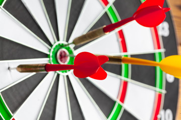 The darts on wooden background