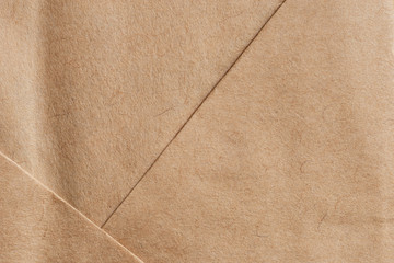Brown paper bag texture ..Close up of  kraft paper bag crease and pattern in flat lay,top view .