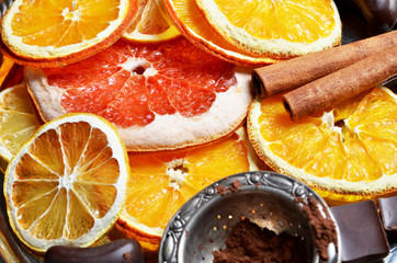 Slice of dried orange,lemon, grapefruit ,cinnamon sticks, chocolate