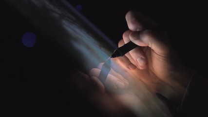 Creative Digital artist editing his artwork on interactive tablet computer at night home office - Powered by Adobe