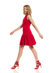 Walking Fashion Model In Red Mini Dress And High Heels