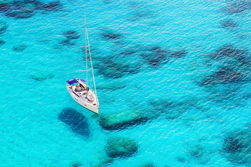 Beautiful bay with sailing boat yacht. Sailboat in a mediterranean sea. Yachting, travel, active...