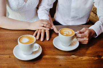 man and woman hands. love and cup coffee concept