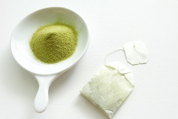 Green tea on white plate and white background. 