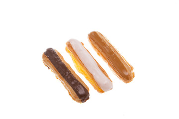 Delicious chocolate eclaire isolated over white background