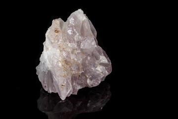 Macro mineral amethyst quartz stone on a black background