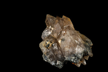 Macro mineral stone smoky quartz, rauchtopaz on a black background