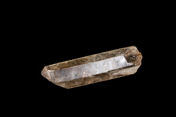 Macro mineral stone smoky quartz, rauchtopaz on a black background