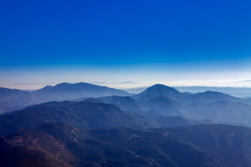Fototapeta na wymiar idyllic scenery with blue mountains 