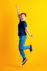 Fototapeta na wymiar funny jumping boy