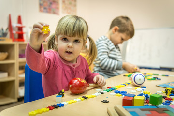 Montessori class, kids are playing and learning