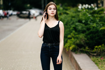 young girl posing on a street in the city