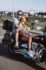 Obraz na płótnie Canvas Hipster freedom stylish young modern couple in love on motorbike hugging each other. Love, relathionships, speed, transport concept
