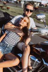 Fototapeta na wymiar Hipster freedom stylish young modern couple in love on motorbike hugging each other. Love, relathionships, speed, transport concept
