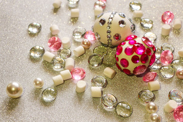 Easter composition flatlay. Easter eggs decorated with shiny rhinestones on  silver background with glass ornaments and pearl beads.
