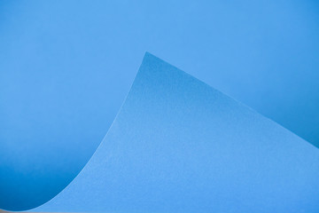 Abstraction of a design blue paper. Empty space on monochrome paper.