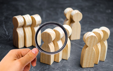 Groups of wooden people. The concept of market segmentation. Marketing segmentation, target...