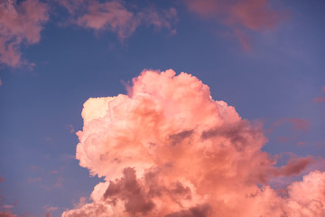 Colorful orange cloud cluster shiny in blue sky