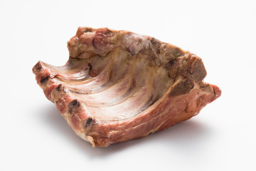 Smoked pork ribs on a white background.