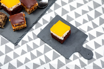 Homemade cake with caramel and oranges on a funcky background.