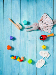 childhood background, baby toys on blue wooden table