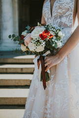wedding bouquet in hands of bride