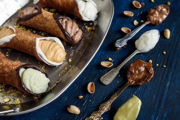 Traditional Sicilian dessert called cannoli with cream