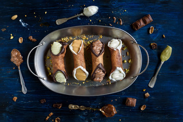 Traditional Sicilian dessert called cannoli with cream