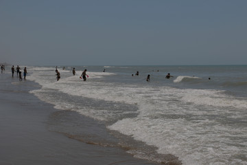 People bathing, swimming in the Tyrrhenian Sea. Warm water. Hot, sunny summer day. A blue cloudless...