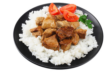 black plate with white rice and goulash isolated on white background