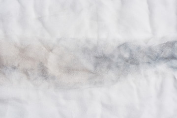 White and gray wrinkled silk. Air folds. Silk fabric texture for background or design element. Thin tissue.