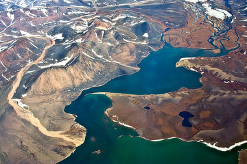Top view of the mouth of the river Chevtakan. Aerial photography. Beautiful landscape with lagoon, coast and mountains (hills). Chukotka, Siberia, Far East of Russia. Amazing Arctic.