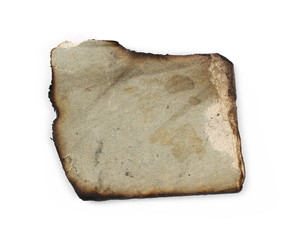 Burned and charred paper scrap isolated on white background, top view